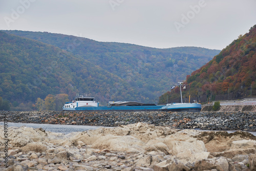 Germany, Rhineland-Palatinate, Bingen, Rhine river, low tide, cargo ship