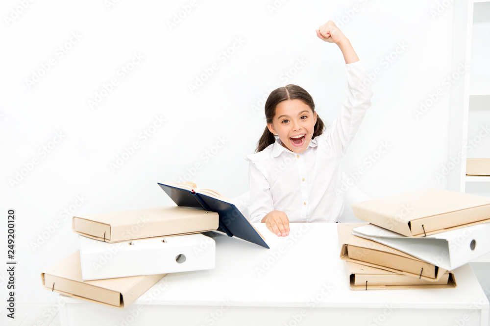 Kid school uniform happy face read book. Excited about knowledge. Homeschooling concept. Interesting book for children. Girl child read book sit table white interior. Schoolgirl studying textbook Kid school uniform happy face read book. Excited about knowledge. Homeschooling concept. Interesting book for children. Girl child read book sit table white interior. Schoolgirl studying textbook