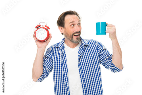 Morning habits. Take control of time. Check time. Tips for saving time. Self discipline. Control and discipline. Drink coffee every day same time. Pleasant moment. Man hold alarm clock and mug coffee