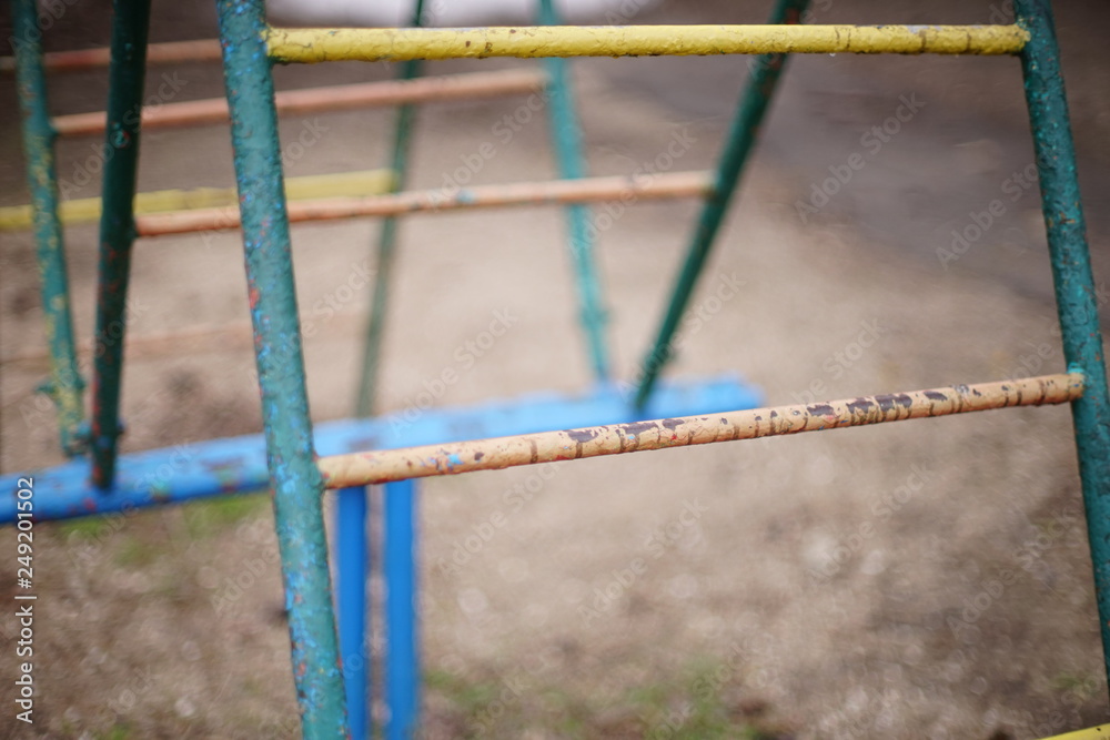 Fototapeta premium Old iron staircase for children with peeling paint.