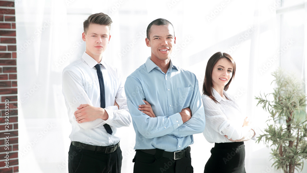 group of successful colleagues on the background of the office group of successful colleagues on the background of the office
