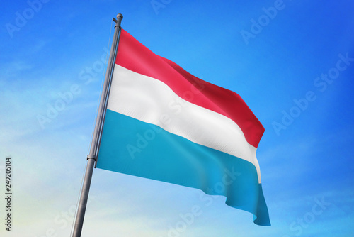 Canvas Print Luxembourg flag waving on the blue sky 3D illustration
