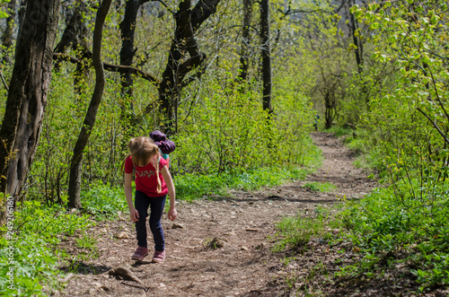 Photography Girl walk or hike through the forest in early spring
