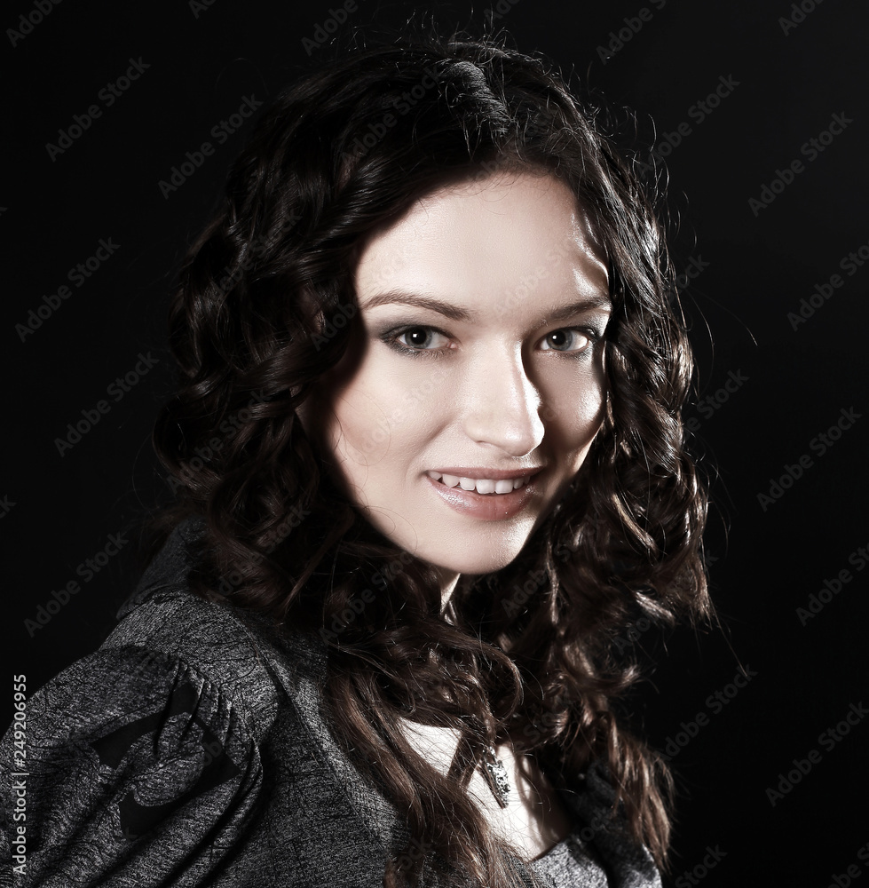 portrait of a smiling beautiful woman .isolated on black portrait of a smiling beautiful woman .isolated on black
