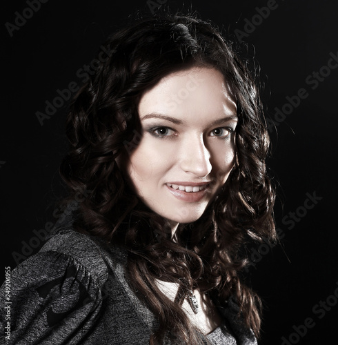 portrait of a smiling beautiful woman .isolated on black
