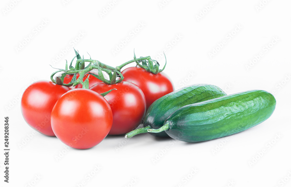 ripe fresh grape tomatoes and cucumbers isolated on white background. Cherry tomato and cucumber vegetable salad concept ripe fresh grape tomatoes and cucumbers isolated on white background. Cherry tomato and cucumber vegetable salad concept