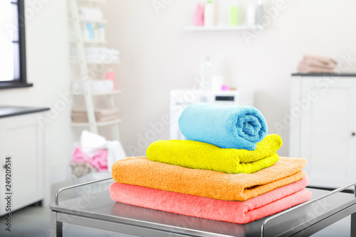 Clean towels on table in laundry room