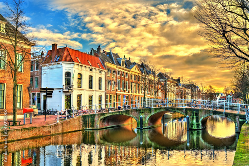 The Doelenbrug bridge across a canal in Leiden, the Netherlands photo
