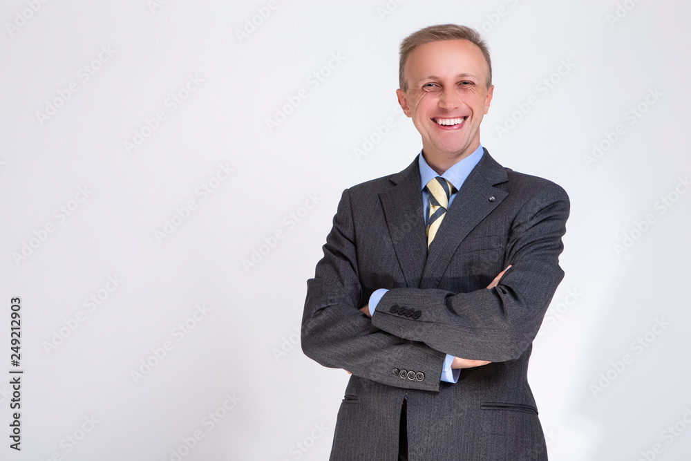 Portrait of Happy Caucasian Successful Businessman in Fashionable Suit and Penny Loafers Against White Background. Portrait of Happy Caucasian Successful Businessman in Fashionable Suit and Penny Loafers Against White Background.