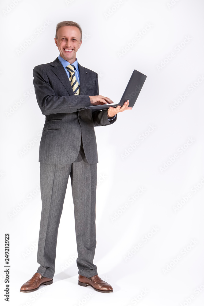 Portrait of Glad Caucasian Businessman with Laptop Against White. Portrait of Glad Caucasian Businessman with Laptop Against White.