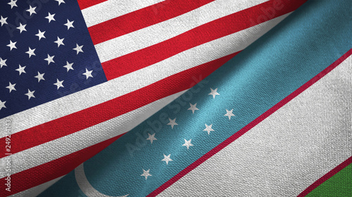 Fototapeta Naklejka Na Ścianę i Meble -  United States and Uzbekistan two flags textile cloth, fabric texture