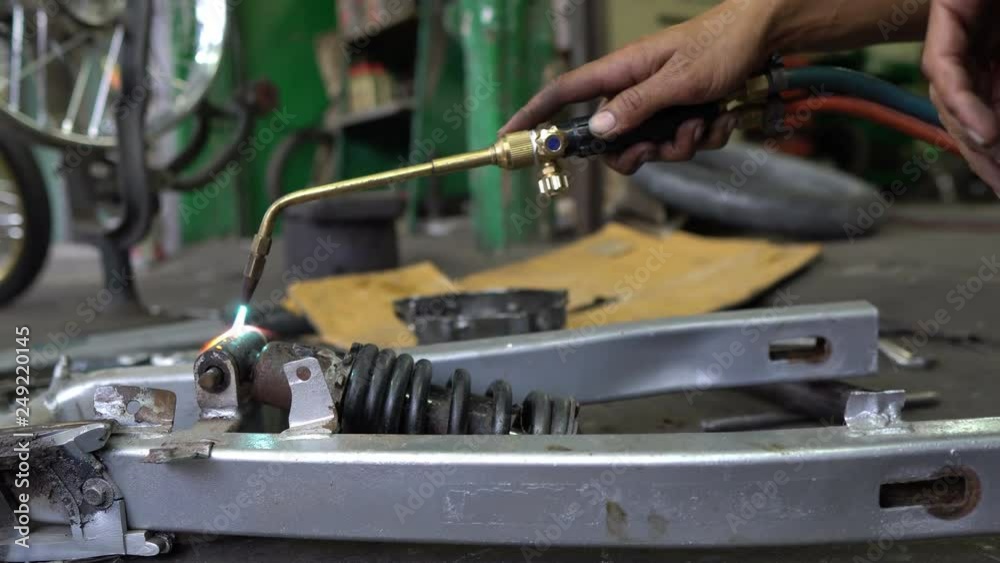Cut old shock absorber at motorcycle garage