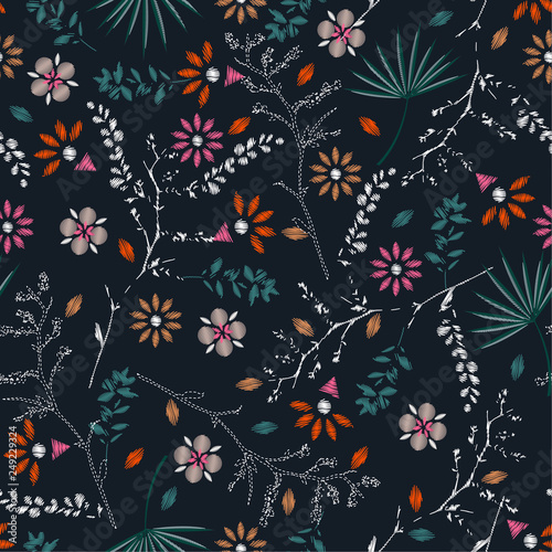 Embroidery colorful floral seamless pattern with liberty botanical leaves. Vector flowers bouquet