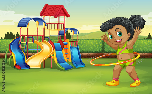A girl doing hula hoop at the park