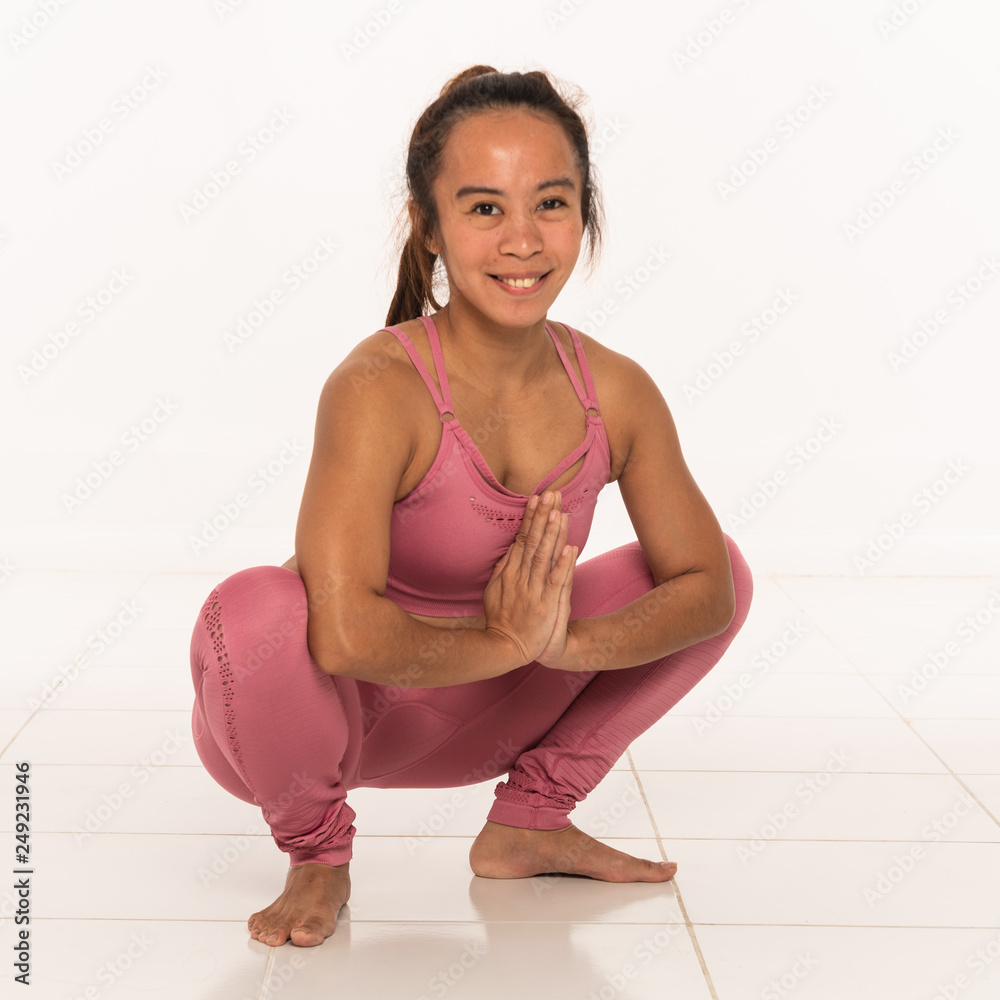 Yoga poses with young Filipino girl Stock Photo