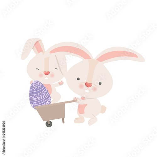 bunnies with wheelbarrow and easter egg icon © grgroup
