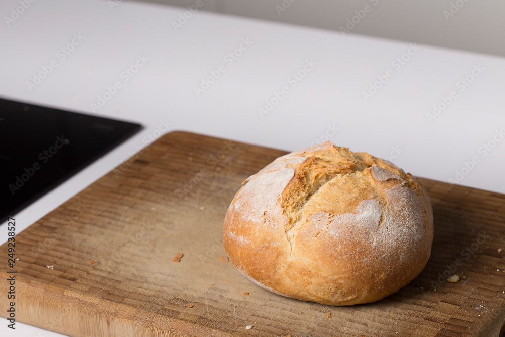 Wheat tasty handmade bred on a wooden surface on a domestic kitchen