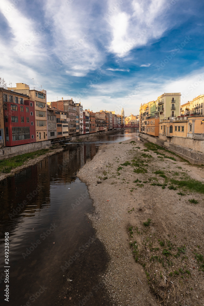 Girona skyline over a wide river with famous landmark cityscape in Catalonia