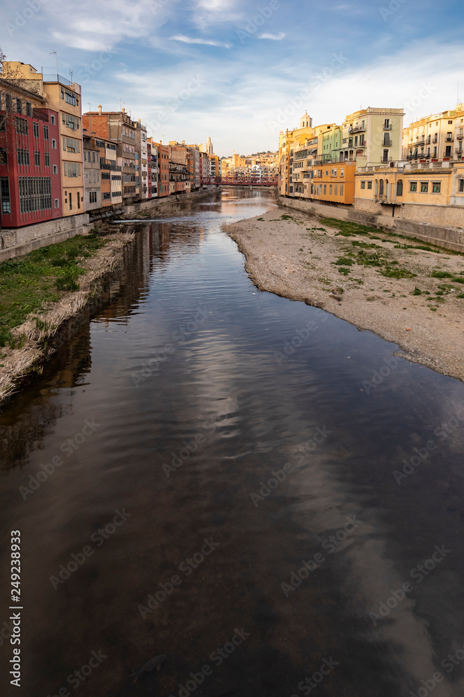 Girona skyline over a wide river with famous landmark cityscape in Catalonia