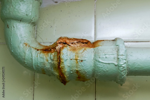 old cracked sewer pipe. rusty pipe