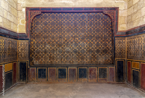 Background of old grunge wooden wall decorated with colorful painted floral patterns, Cairo, Egypt photo