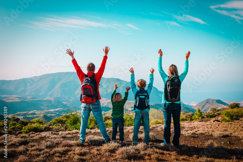 happy mom and dad with kids travel in mountains, happy family enjoy hiking