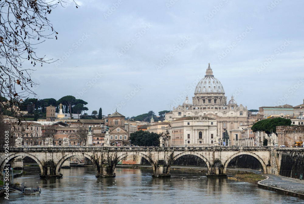 Beautiful view of the Cathedral of St. Peter and the Tiber River in Rome.
