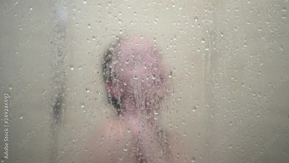 girl takes shower and discovers that she is being spied on in bathroom. girl takes shower and discovers that she is being spied on in bathroom.