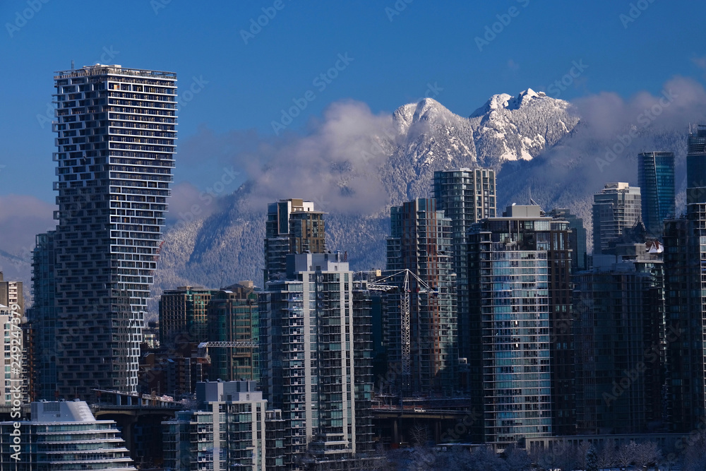 View of Vancouver and Grouse Mountain under the snow. Winter day in Vancouver. British Columbia. Canada.