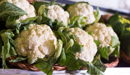 Fresh cauliflower on market counter photo