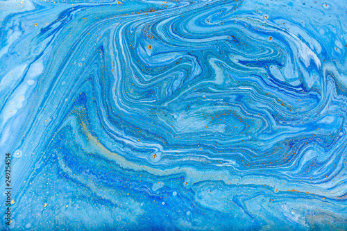 Blue and gold marbling pattern. Golden marble liquid texture.