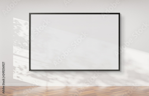 Fototapeta Naklejka Na Ścianę i Meble -  Black frame hanging on a wall mockup 3d rendering