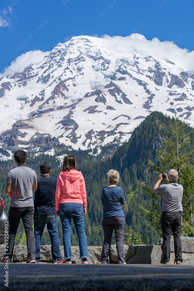 Tourists in taking pictures of Mt. Rainier in summer