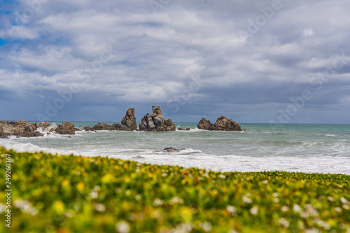 amazing coastline at cape foulwind Westport New Zealand, great coast with the waves of the ocean in the background, ocean in new Zealand with great rocks and beach, cape foulwind landscape image photo