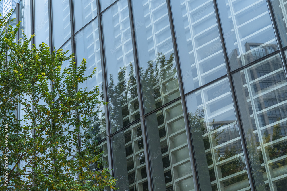 modern office building with green trees. modern office building with green trees.