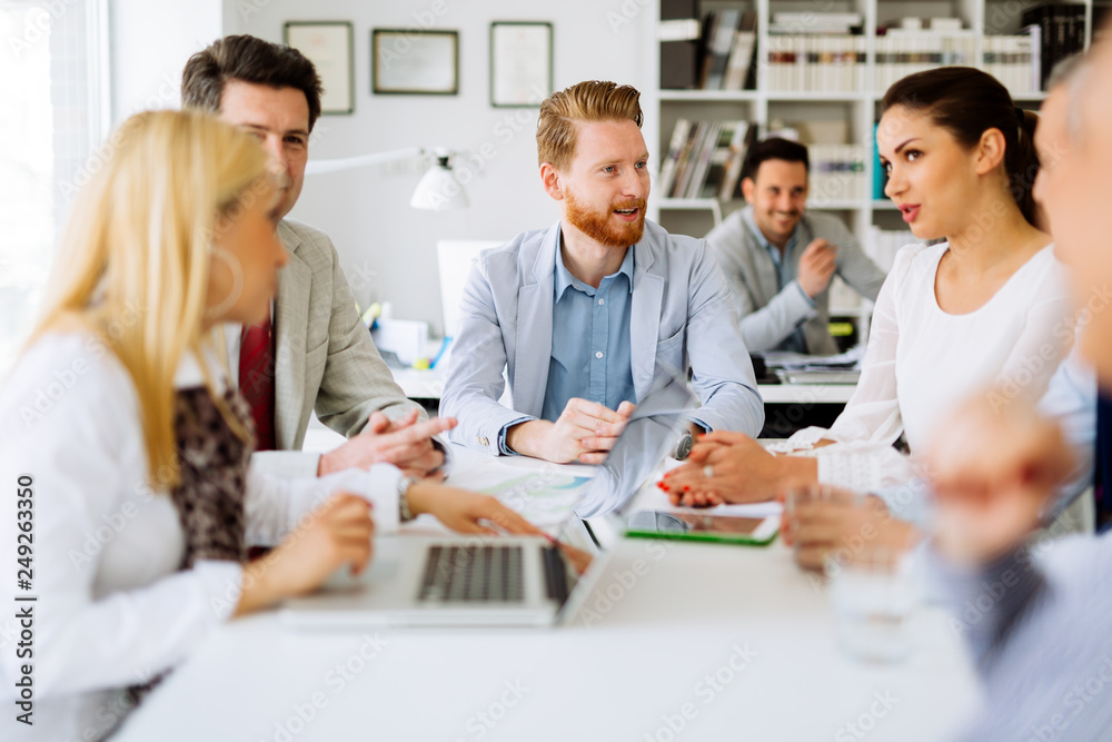 Group of business people working as team in office Group of business people working as team in office