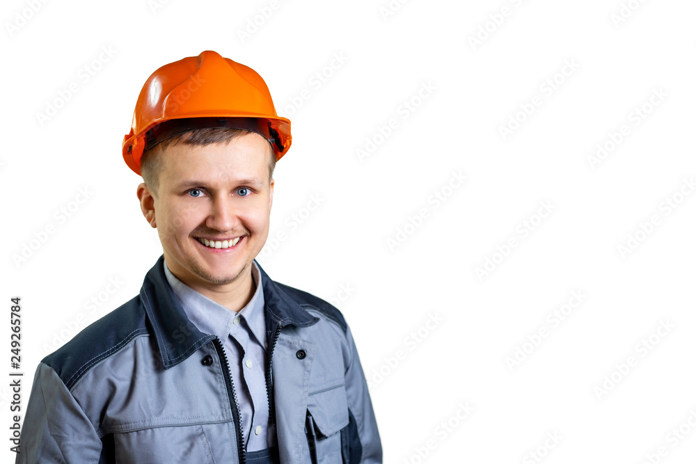 Portrait of a young engineer worker in orange helmet. He is happy ready to go. Repair and construction. isolated. Close-up Portrait of a young engineer worker in orange helmet. He is happy ready to go. Repair and construction. isolated. Close-up