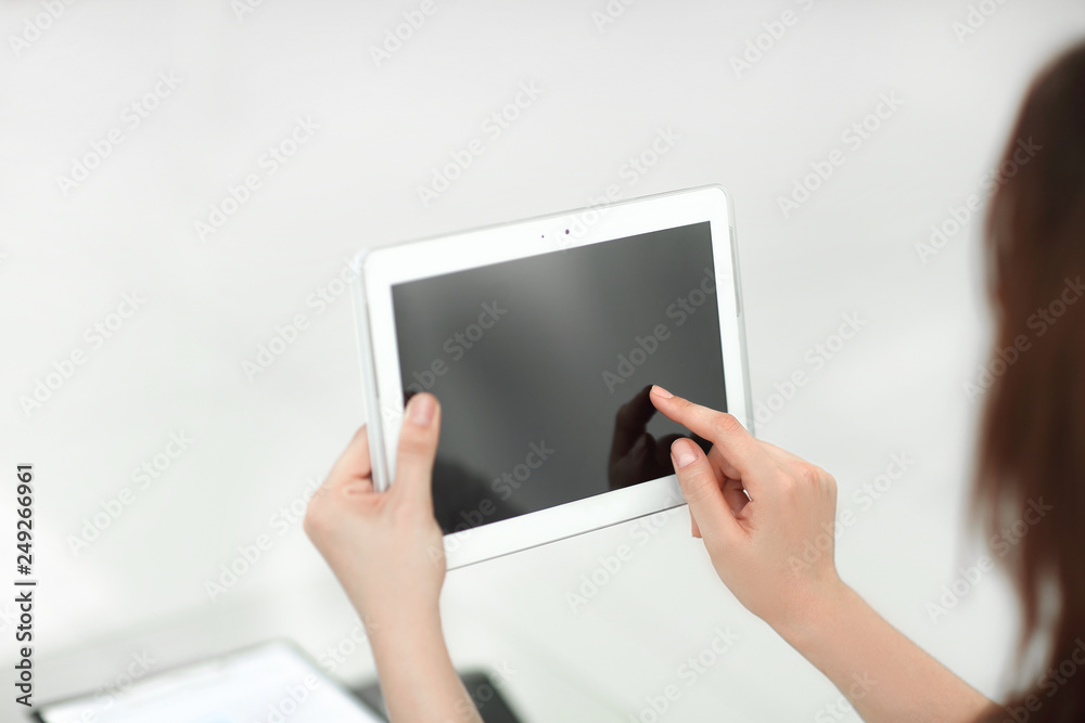 rear view. business woman using digital tablet