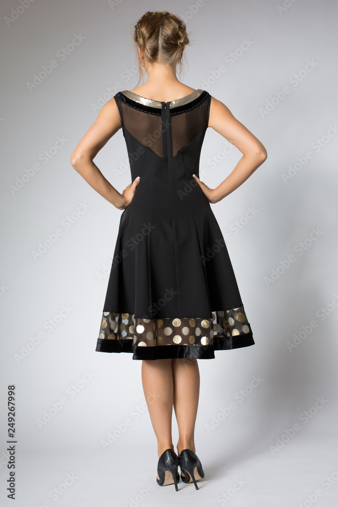 Beautiful blonde girl posing in luxury black dress Beautiful blonde girl posing in luxury black dress