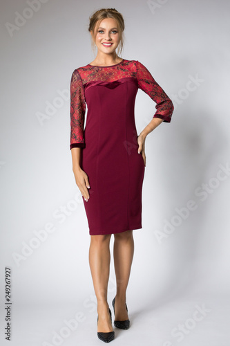 Beautiful model posing in fashion red dress