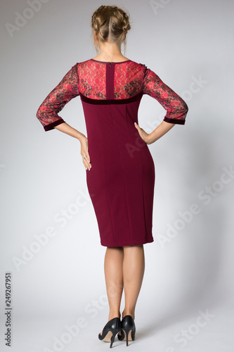 Beautiful model posing in fashion red dress