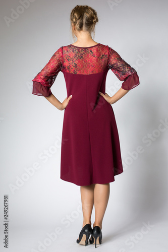Beautiful model posing in fashion red dress