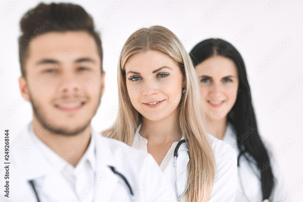 group of smiling hospital colleagues standing together group of smiling hospital colleagues standing together