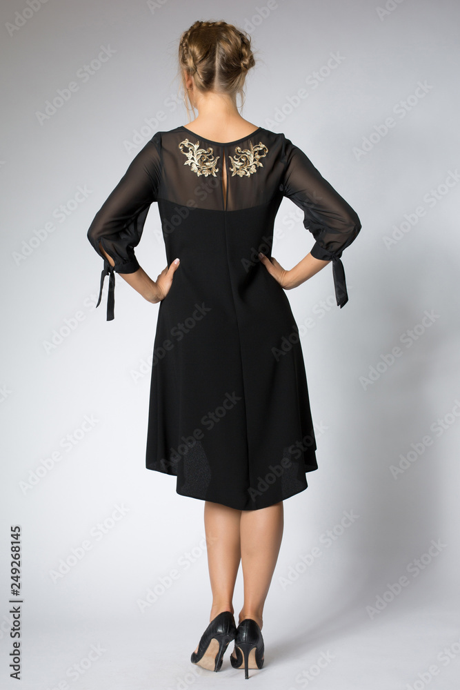 Beautiful blonde girl posing in luxury black dress Beautiful blonde girl posing in luxury black dress