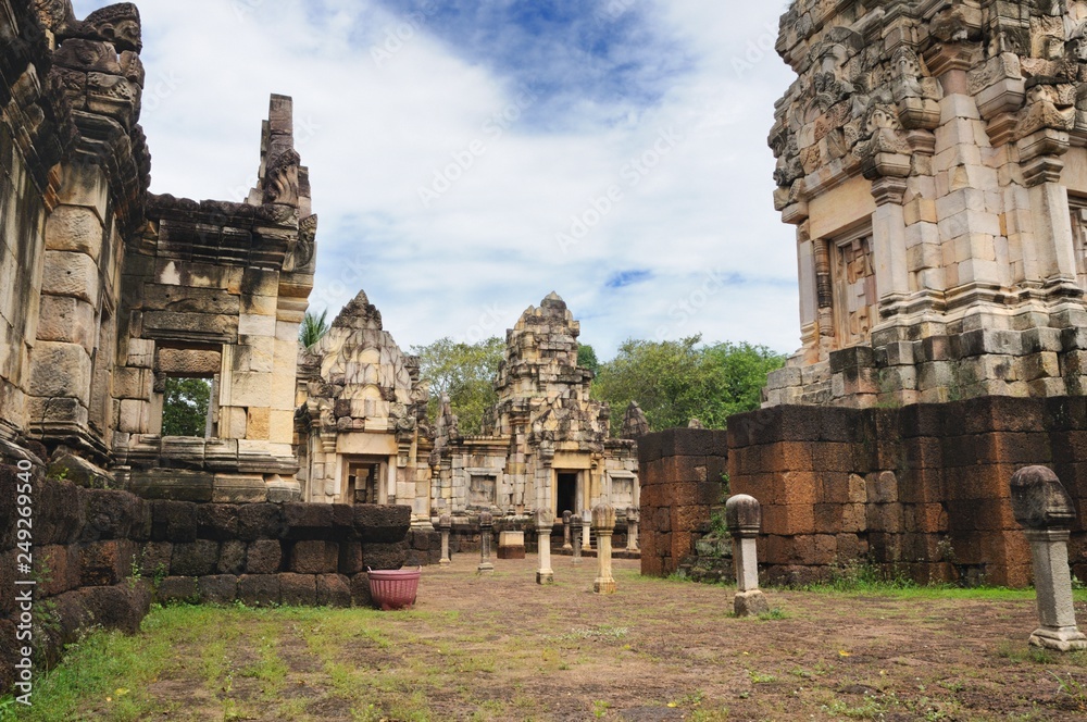 Main tower, courtyard and libraries of ancient Khmer temple Prasat Sdok Kok Thom built of red sandstone and laterite in Sa Kaeo province of Thailand