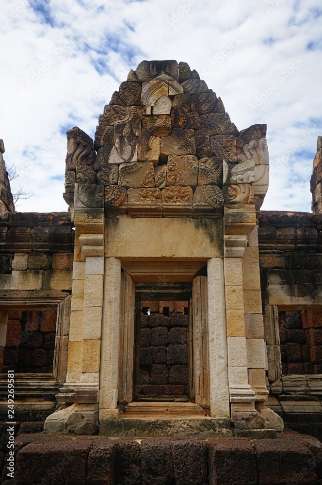 A windows of the gallery of the ancient Khmer temple Prasat Sdok Kok Thom built of red sandstone and laterite in Sa Kaeo province of Thailand