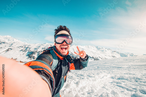Happy handsome man taking a selfie hiking  photo