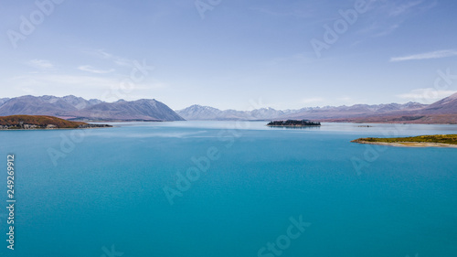 Lake tekapo from the air  aerial shot of the beautiful lake tekapro in New Zealand  stunning blue water lake in New Zealand  aerial photography of amazing nature  nature photography with a drone 