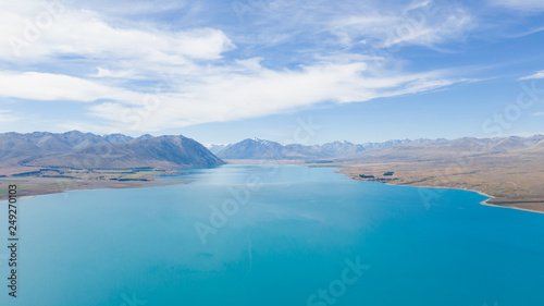 Lake tekapo from the air  aerial shot of the beautiful lake tekapro in New Zealand  stunning blue water lake in New Zealand  aerial photography of amazing nature  nature photography with a drone 