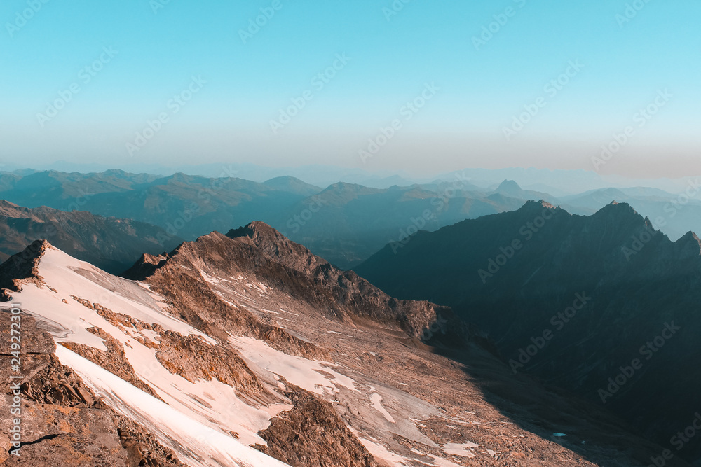 Mountains in the shadow. Sunrise at the Kesskogel summit.